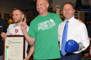 Carl Frampton, left, poses for a picture with Champs Boxing Club owner Ryan O’Leary and Westchester County Executive Rob Astorino in New Rochelle on July 12. Frampton trained at the New Rochelle gym in preparation for his July 30 fight against Leo Santa Cruz, in which the Irish fighter won the WBA featherweight title. Photo/Bobby Begun