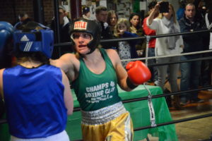 Brittany Plummer from Champs Boxing Club lands a right hand against Denice O’Leary from Ireland on March 18. Plummer was victorious in her first amateur fight.