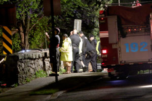 Police and firefighters blocked off Park Avenue overlooking Beaver Swamp Brook on the night of May 6 to rescue the body of Roxanda Cifuentes, who drowned herself. 
Photo/Andrew Dapolite