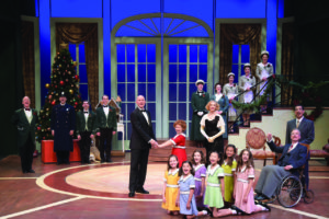 The cast of “Annie” on stage at the Westchester Broadway Theatre.