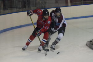 Max Chalfin fights for a puck last season. Chalfin comes into this season as the team’s returning leader in points.