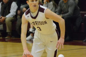 Luke McCarthy looks for open space against Eastchester on Dec. 14. McCarthy scored 17 points to lead the Huskies to victory.