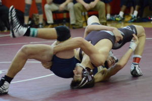 Tyler Joseph locks up a Beacon opponent on Dec. 2 at Rye High School. Joseph won the 120-pound individual crown at the Bernie Miller Dual Meet and posted a 5-0 record.