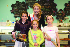 Competitors from the first annual baking competition pose with Mrs. New York City.