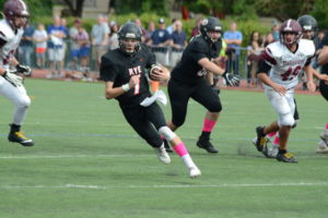 Declan Lavelle runs with the football against Harrison on Oct. 7. Lavelle accounted for 73 percent of Rye’s total offensive yards.