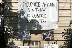 This makeshift banner quoting Martin Luther King Jr. and draped over the front window of this Webster Road home, led to a dispute this week when Eastchester officials told the Brown family they were in violation of a local sign ordinance. Photos courtesy Avisia Brown