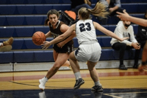 Mia Strazza drives to the hoop against Eastchester on Jan. 18, 2022. Strazza was one of three Harrison players to record 17 points.