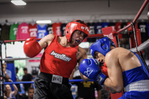 Rafael Castillo connects with a punch in his 139 lb. Elite Male championship bout against Antonio Tantillo. Tantillo edged Castillo with a split-decision victory.