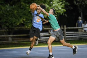 Ethan Lithgow goes after a loose ball at Hudson Park on July 25. Photos/Mike Smith