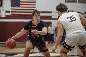 Rye's Jake Kessner surveys the defense during a Jan. 28 game against Harrison.