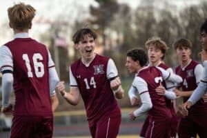 Harrison celebrae a goal during its Nov. 2 section final game against Mahopac.