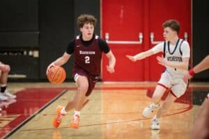 Matt McCoy speeds past a defender during Harrison's game against Eastchester on Jan. 20. The Huskies topped the Eagles 57-42.